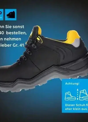 Schwarzer Sicherheitsschuh mit gelbem Innenfutter, rutschfeste Sohle, Profi Arbeitsschuhe, Hinweis auf kleinere Passform.