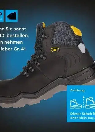 Schwarzer Sicherheitsschuh mit gelben Details, robuste Sohle, Hinweis auf kleine Passform, Arbeitsschutz