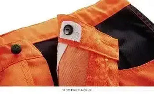 Detailaufnahme orange Schutzkleidung mit Druckknopf, robuste Arbeitskleidung, Hygiene Bekleidung